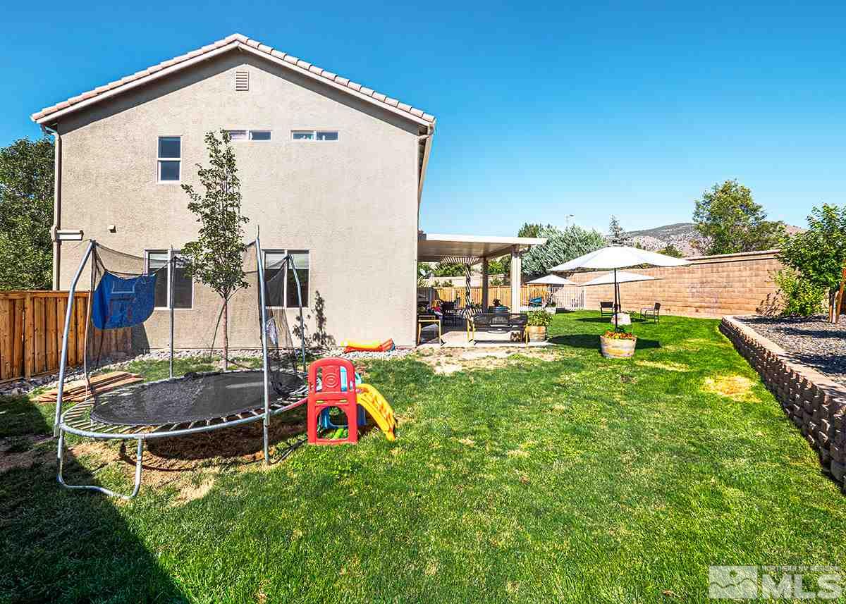 590 Verelli Court Reno, NV 89521 - Photo 21 of 23 a view of a house with backyard