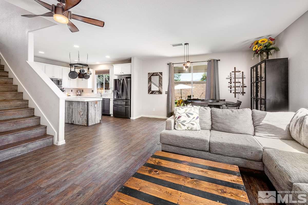 590 Verelli Court Reno, NV 89521 - Photo 4 of 23 a living room with furniture and a chandelier
