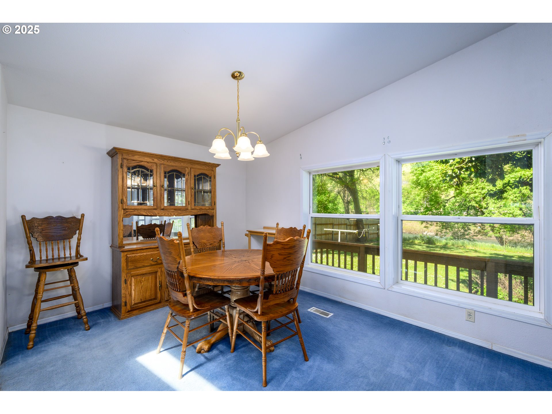 694 Tipton Road Roseburg, OR 97471 - Photo 15 of 36 a view of a dining room with furniture window and wooden floor