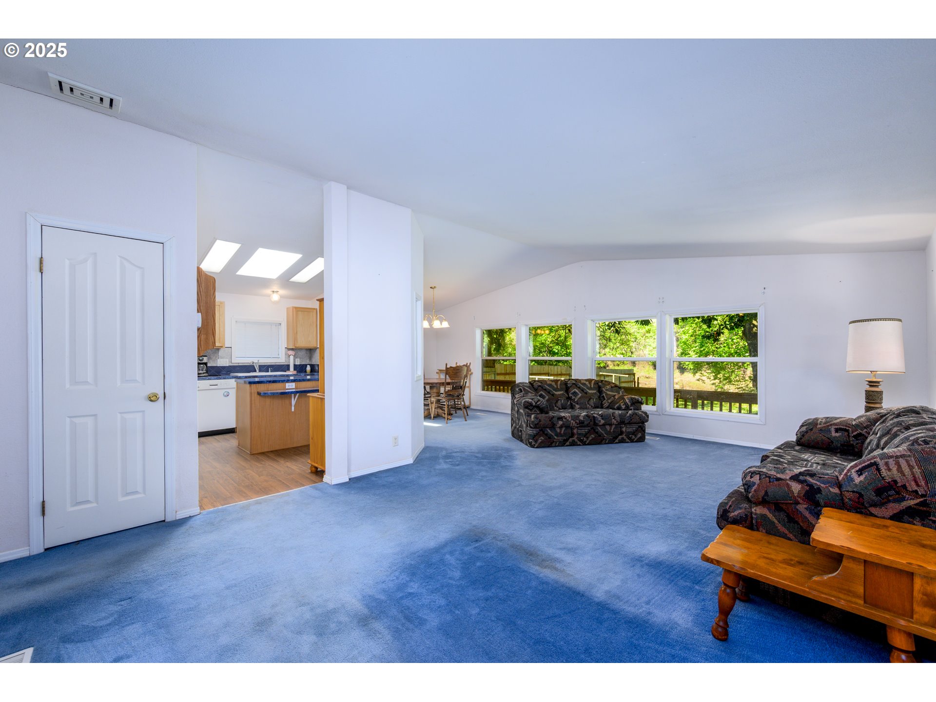 694 Tipton Road Roseburg, OR 97471 - Photo 19 of 36 a living room with furniture and a large window