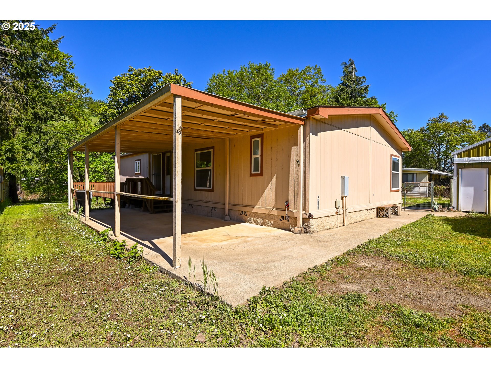 694 Tipton Road Roseburg, OR 97471 - Photo 2 of 36 a view of a house with backyard and sitting area