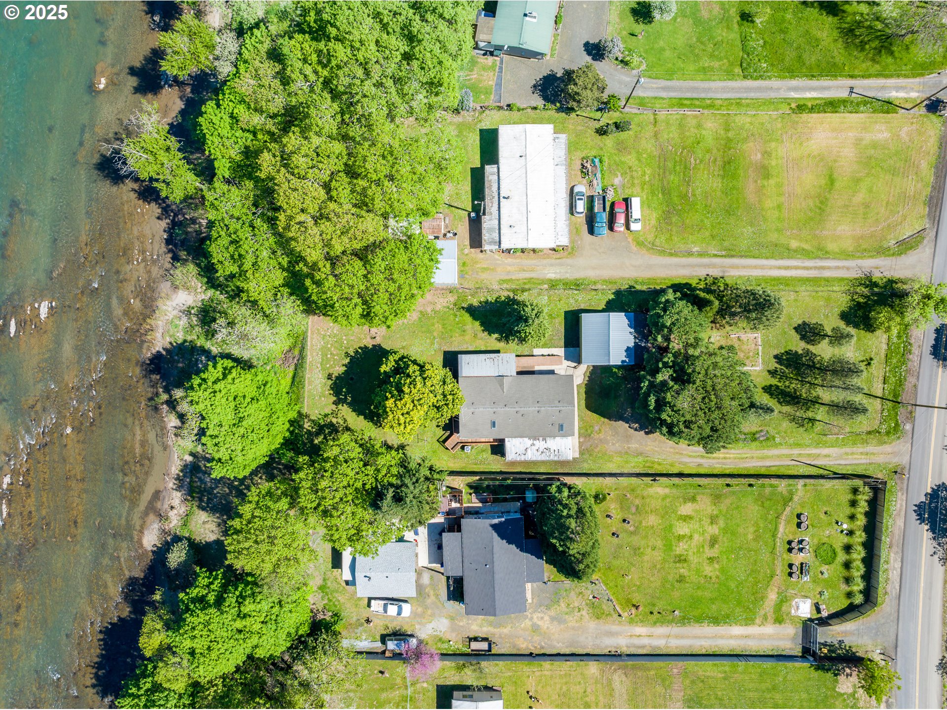 694 Tipton Road Roseburg, OR 97471 - Photo 32 of 36 an aerial view of a house with a yard