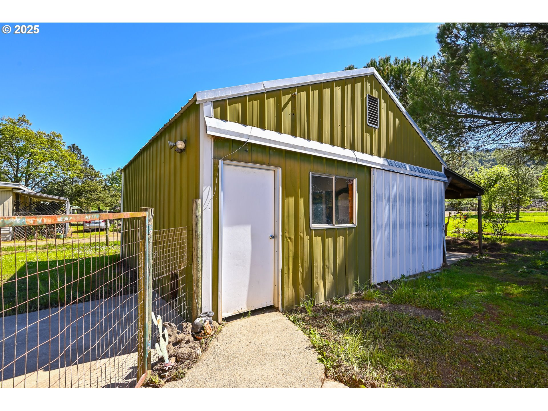 694 Tipton Road Roseburg, OR 97471 - Photo 4 of 36 a view of a house with backyard and sitting area