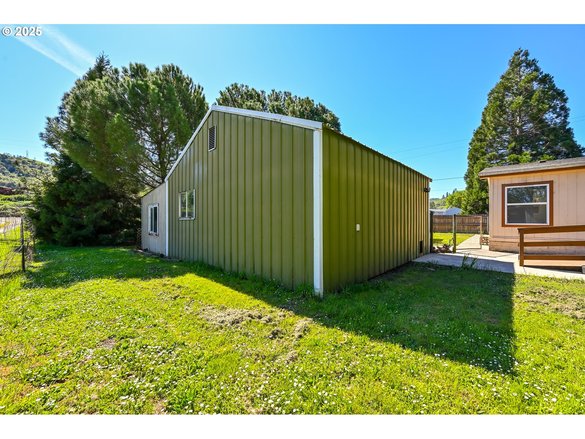 694 Tipton Road Roseburg, OR 97471 - Photo 5 of 36 a view of a back yard of the house