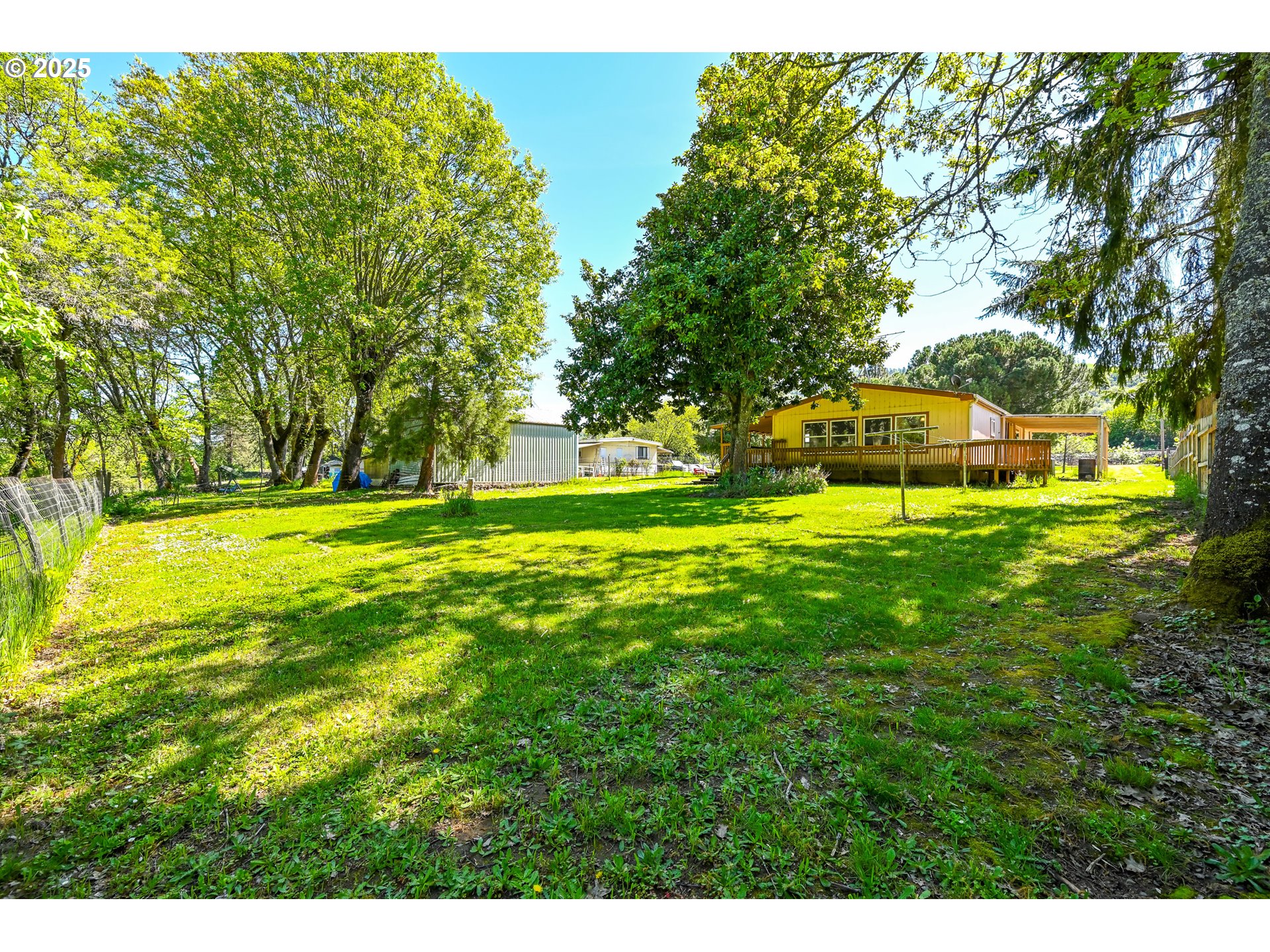 694 Tipton Road Roseburg, OR 97471 - Photo 8 of 36 a view of a park with large trees