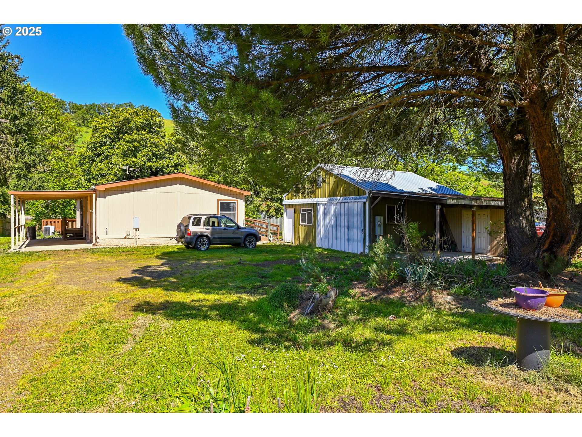 694 Tipton Road Roseburg, OR 97471 - Photo 9 of 36 a view of a house with a yard