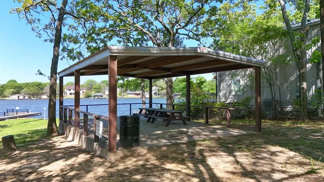 a view of a patio with a table chairs and a backyard