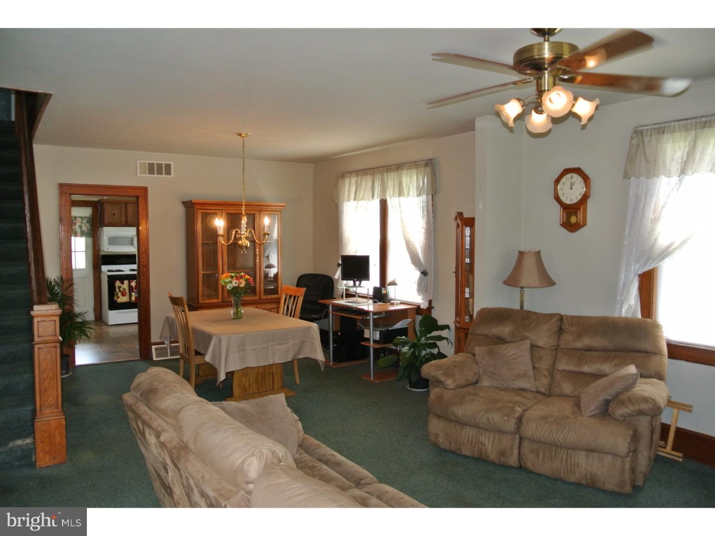 214 Grant Street Riverside, NJ 08075 - Photo 3 of 24 a living room with furniture a chandelier and a large mirror