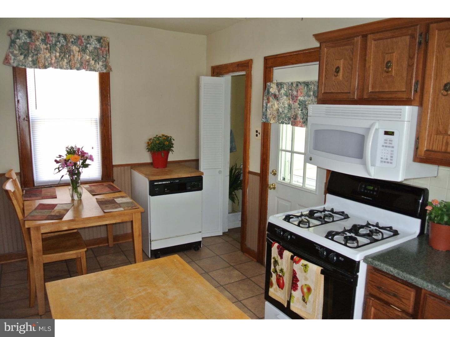214 Grant Street Riverside, NJ 08075 - Photo 8 of 24 a kitchen with a stove and a refrigerator