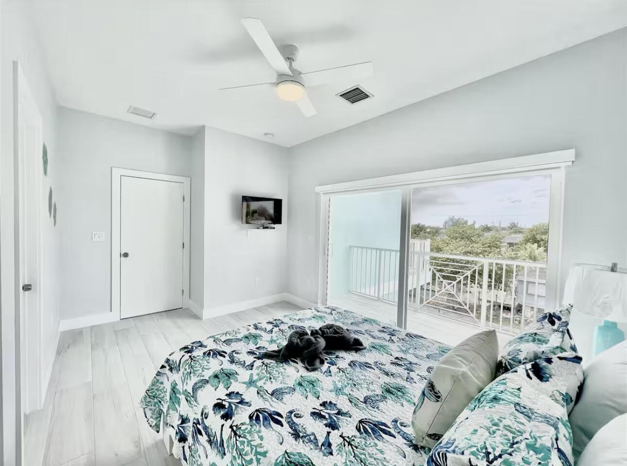 1021 82nd Street Marathon, FL 33050 - Photo 15 of 33 a bedroom with a bed and a large window
