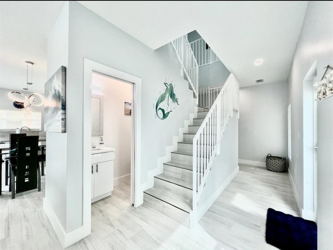 1021 82nd Street Marathon, FL 33050 - Photo 4 of 33 a view of entryway and hall with wooden floor