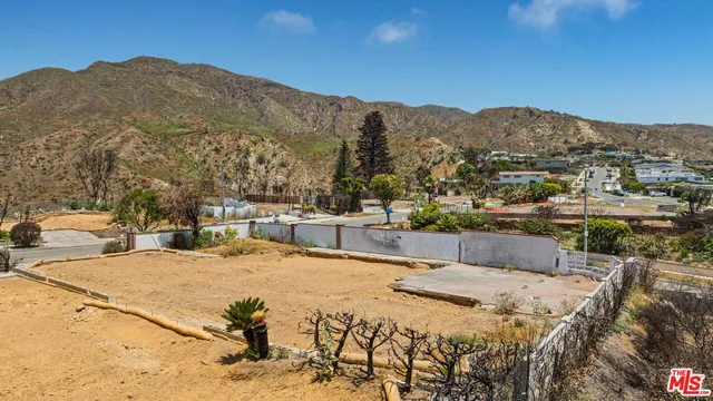 a view of a swimming pool with an ocean view