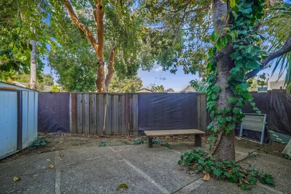 a view of outdoor space and wooden fence