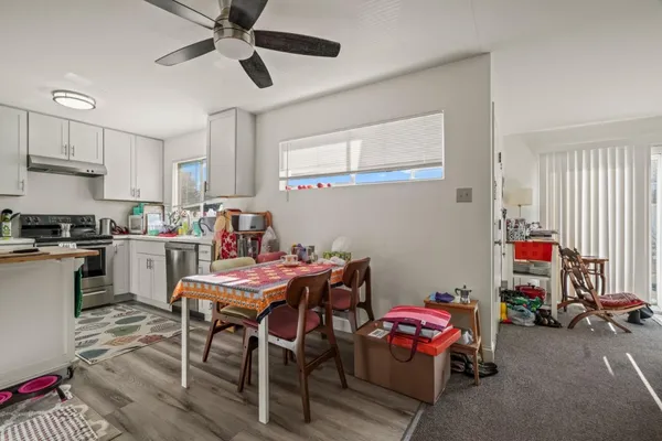 a kitchen with a table and chairs in it
