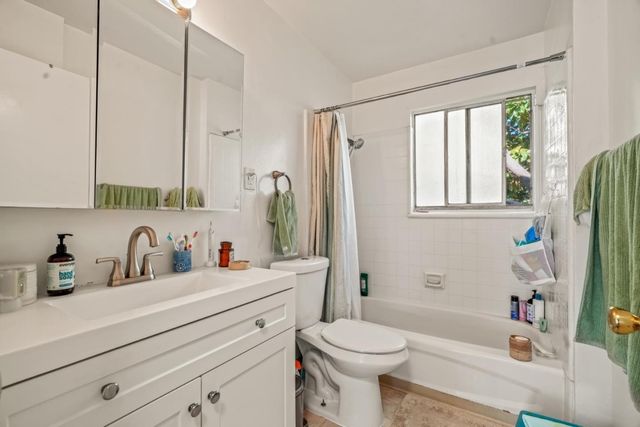 a bathroom with a sink a toilet and a bathtub