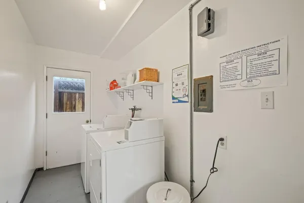 a bathroom with a sink toilet and mirror