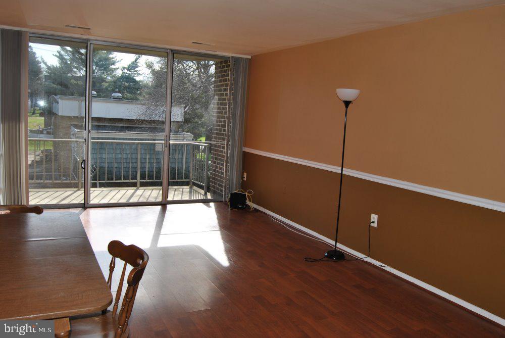 3910 Bel Pre Road, Unit 3 Silver Spring, MD 20906 - Photo 6 of 18 Spacious living room with access to balcony