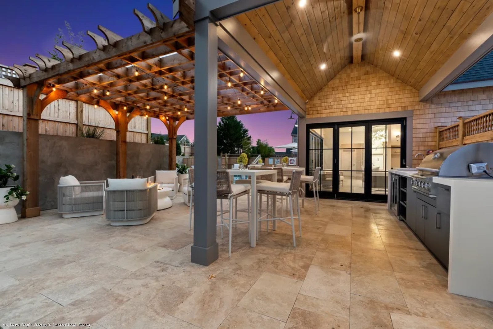 10 Beach Grass Road Nantucket, MA 02554 - Photo 28 of 29 a view of a patio with a table and chairs