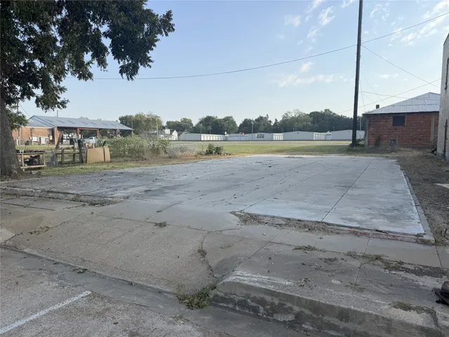 a view of a swimming pool with a yard