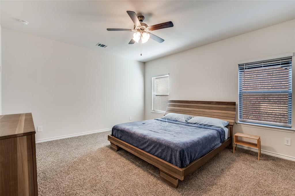 3876 Lyndhurst Avenue Little Elm, TX 75068 - Photo 11 of 25 a bedroom with a bed and window