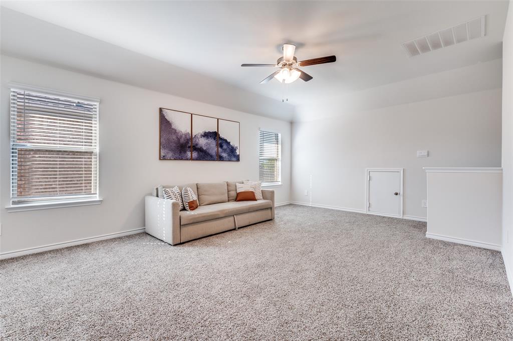3876 Lyndhurst Avenue Little Elm, TX 75068 - Photo 15 of 25 a living room with furniture and a window