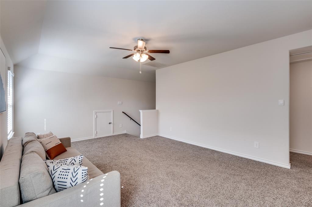 3876 Lyndhurst Avenue Little Elm, TX 75068 - Photo 16 of 25 a living room with furniture and a ceiling fan