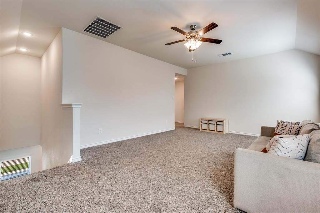 3876 Lyndhurst Avenue Little Elm, TX 75068 - Photo 17 of 25 a living room with furniture and a ceiling fan