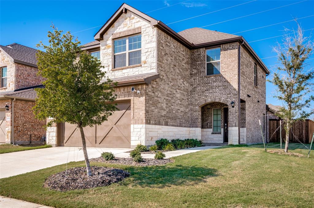 3876 Lyndhurst Avenue Little Elm, TX 75068 - Photo 2 of 25 a front view of a house with garden