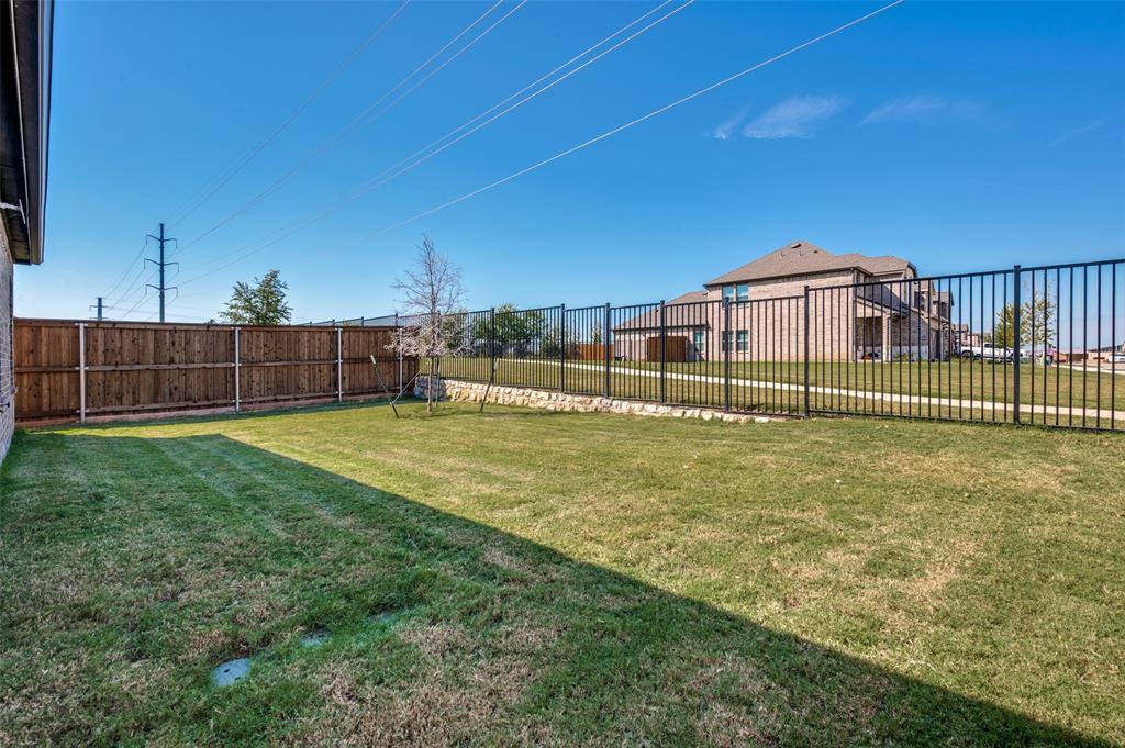 3876 Lyndhurst Avenue Little Elm, TX 75068 - Photo 24 of 25 a view of a house with a big yard