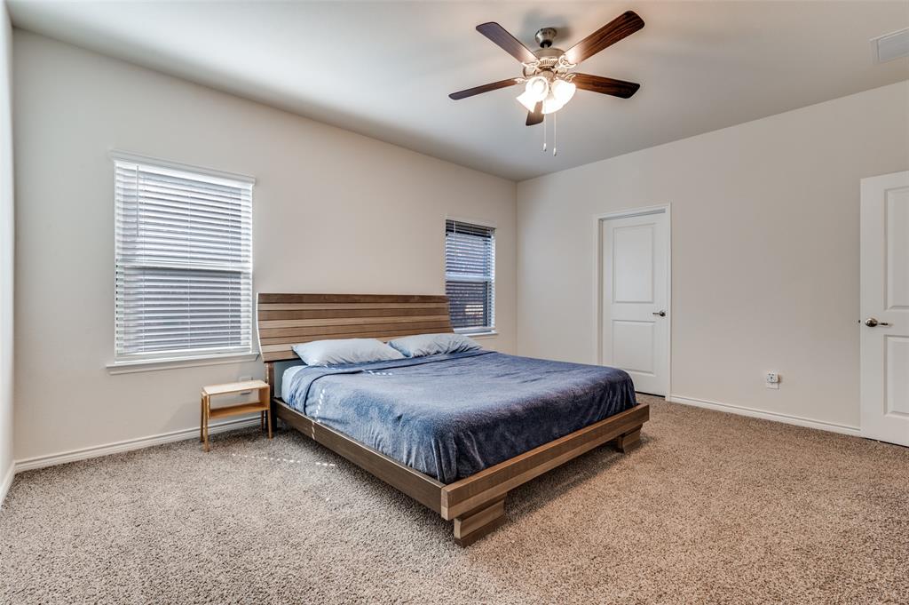 3876 Lyndhurst Avenue Little Elm, TX 75068 - Photo 10 of 25 a bedroom with a bed and window