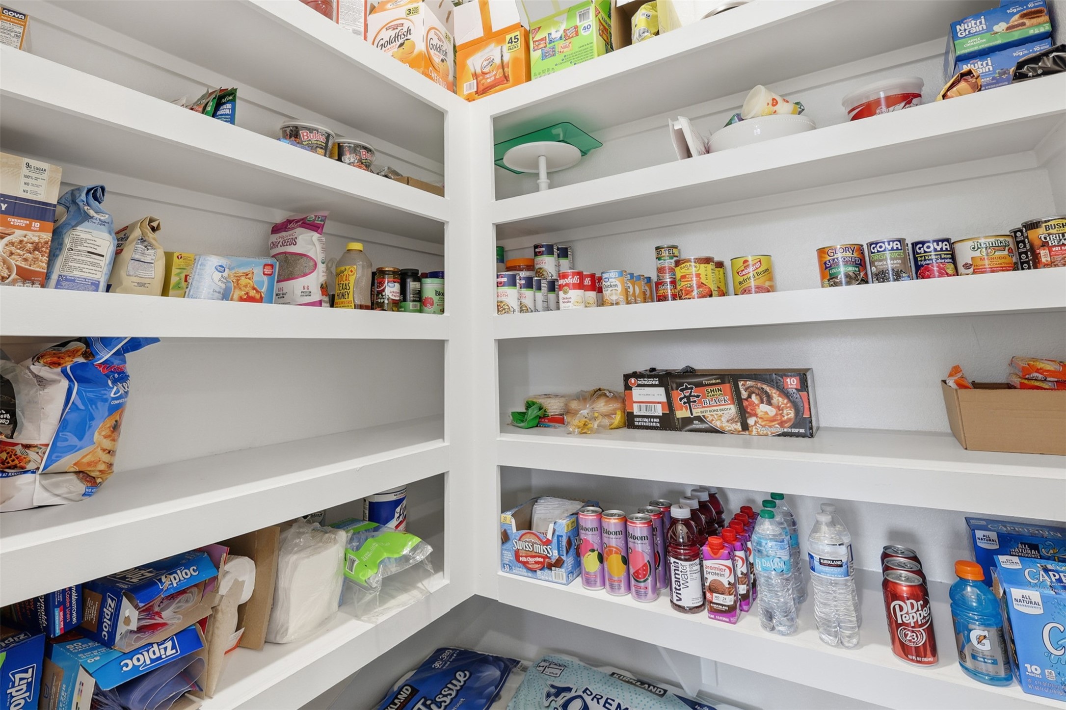 17719 Winfall Drive Crosby, TX 77532 - Photo 19 of 47 Spacious pantry with multiple white shelves, providing ample storage and easy organization.