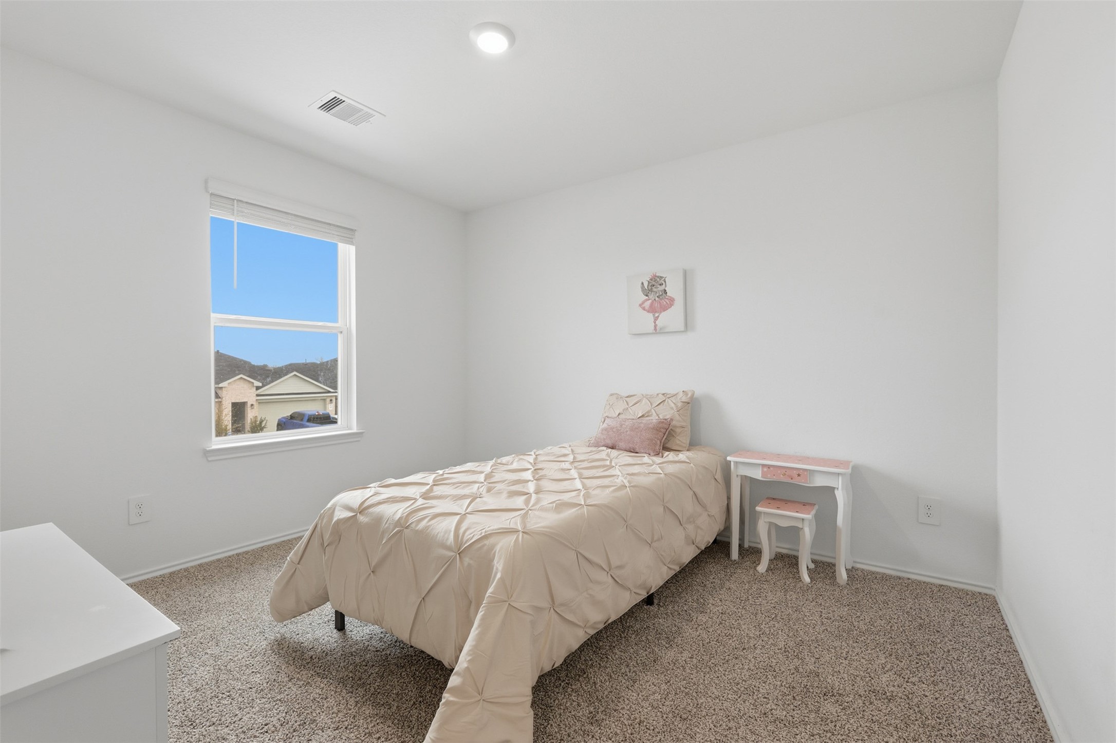 17719 Winfall Drive Crosby, TX 77532 - Photo 29 of 47 This cozy secondary bedroom features soft carpet and a window providing natural light and a view of the neighborhood.
