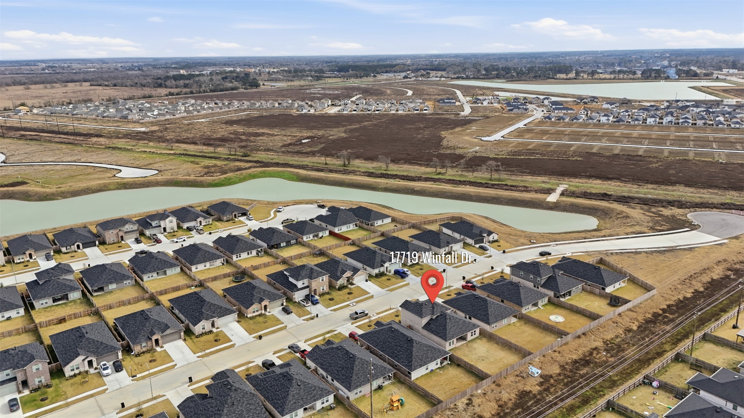 17719 Winfall Drive Crosby, TX 77532 - Photo 43 of 47 The area features well-maintained properties, nearby water features, and open spaces, offering a peaceful and organized community setting.