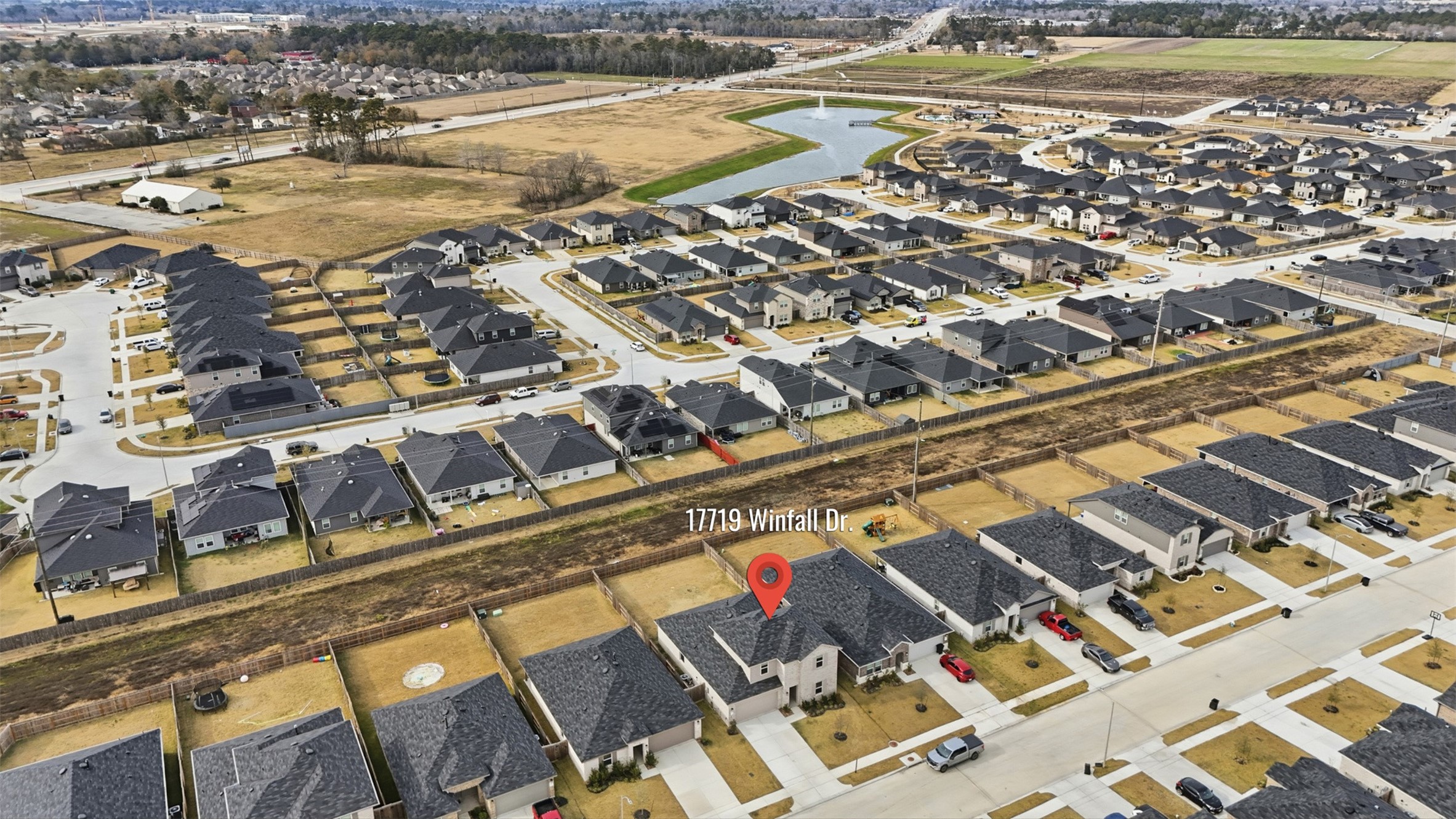 17719 Winfall Drive Crosby, TX 77532 - Photo 6 of 47 The area features well-maintained streets, some green spaces, and a small waterway nearby, offering a peaceful residential setting.
