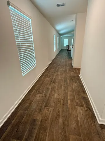 a view of an empty room and a window