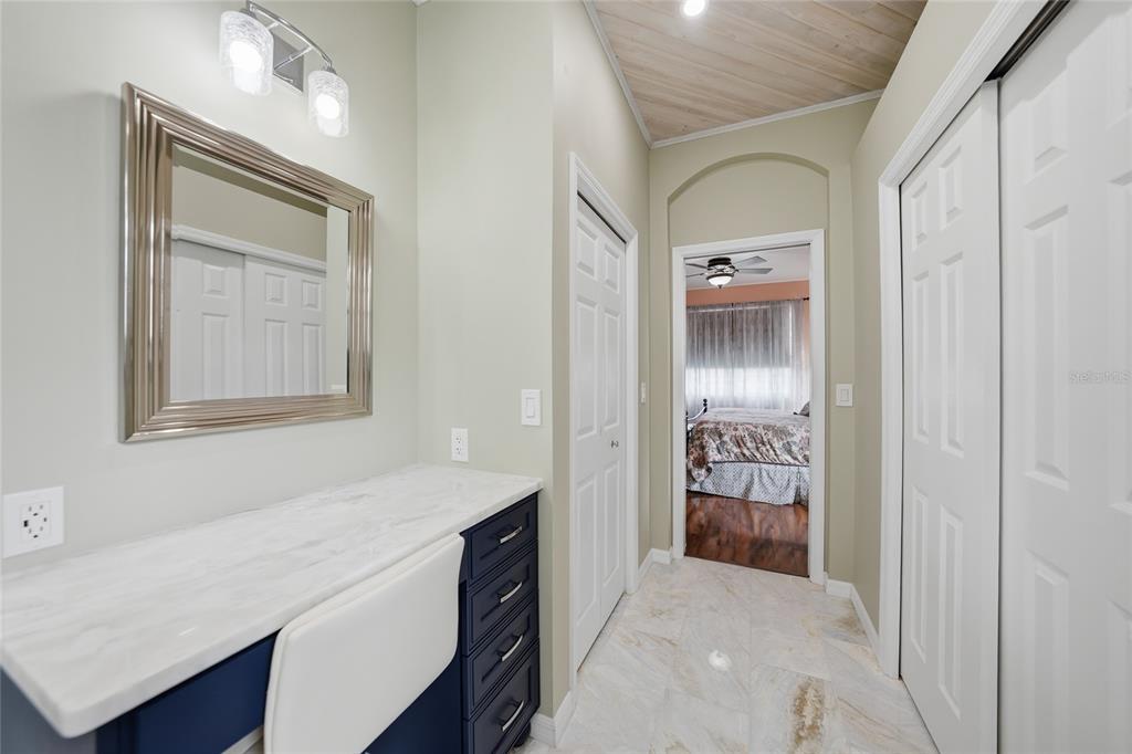 5221 Layton Drive Venice, FL 34293 - Photo 16 of 33 a bathroom with a sink a vanity and a mirror