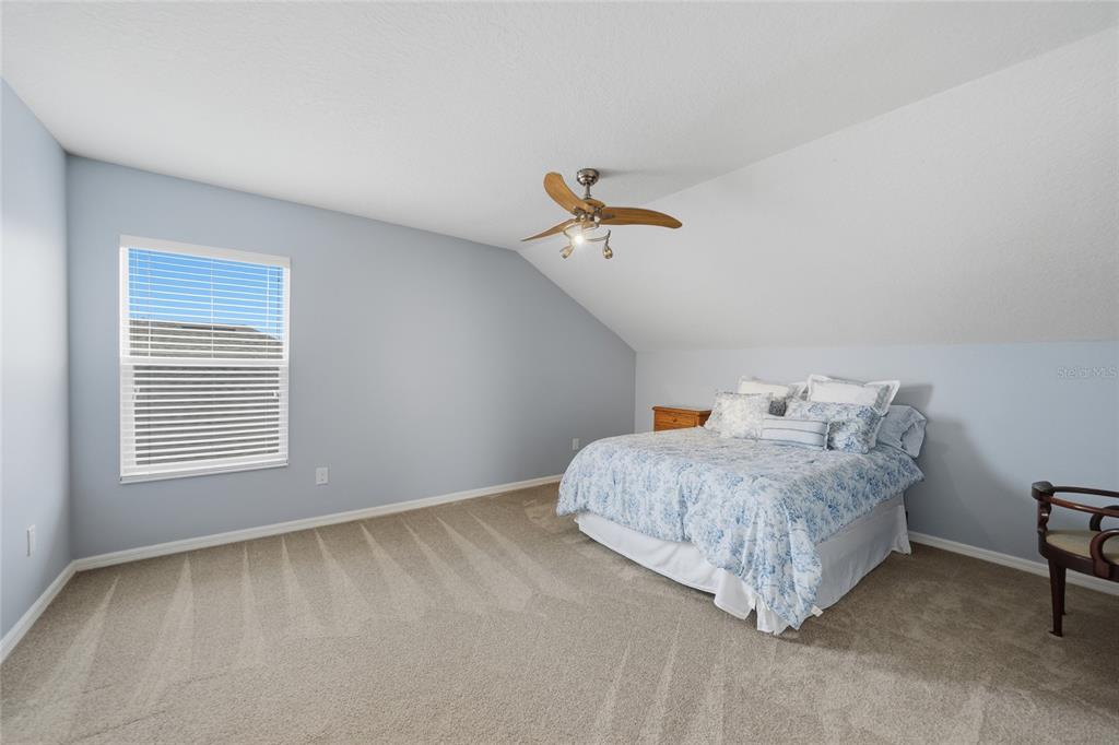 5221 Layton Drive Venice, FL 34293 - Photo 24 of 33 a bedroom with a bed and a window