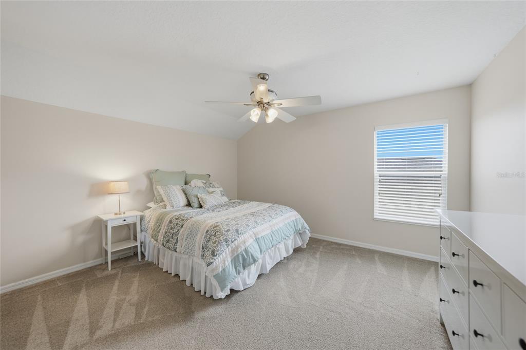 5221 Layton Drive Venice, FL 34293 - Photo 26 of 33 a bed room with a bed and a window
