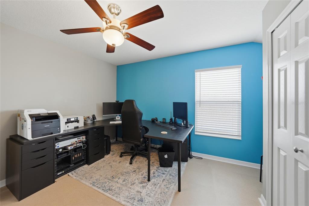 5221 Layton Drive Venice, FL 34293 - Photo 28 of 33 a view of a workspace with furniture and a window