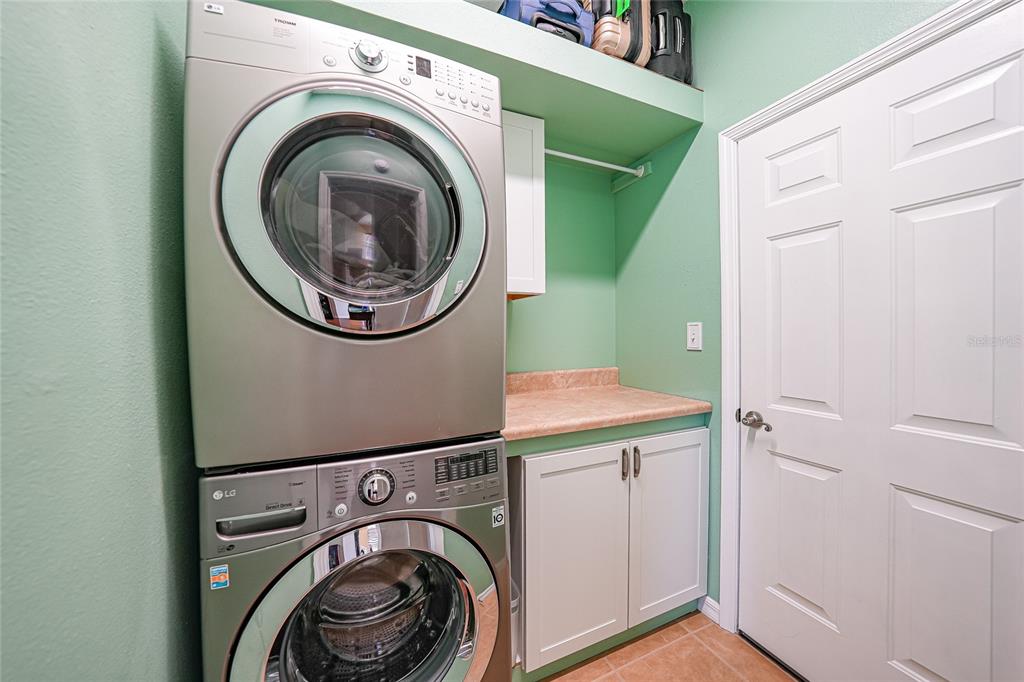 5221 Layton Drive Venice, FL 34293 - Photo 30 of 33 a utility room with dryer and washer