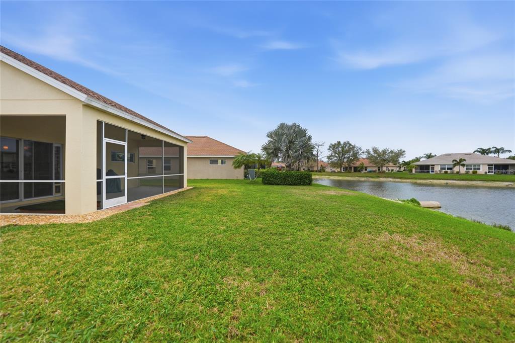 5221 Layton Drive Venice, FL 34293 - Photo 32 of 33 a view of a backyard with a garden