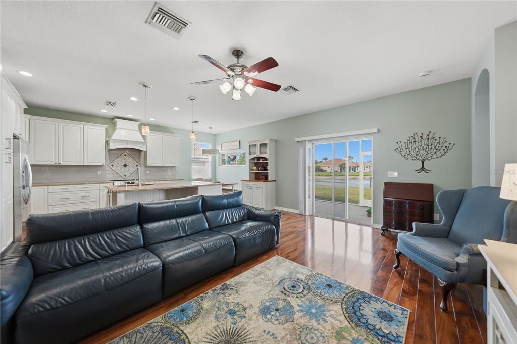 5221 Layton Drive Venice, FL 34293 - Photo 10 of 33 a living room with furniture and a fireplace