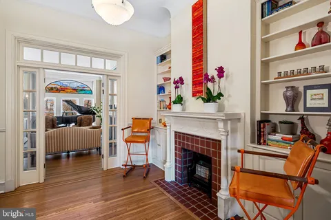 a kitchen with stainless steel appliances granite countertop a sink stove and wooden cabinets
