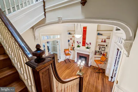 a view of living room with furniture and wooden floor