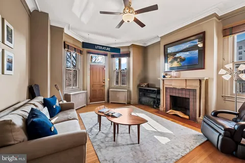 an aerial view of a house with large trees