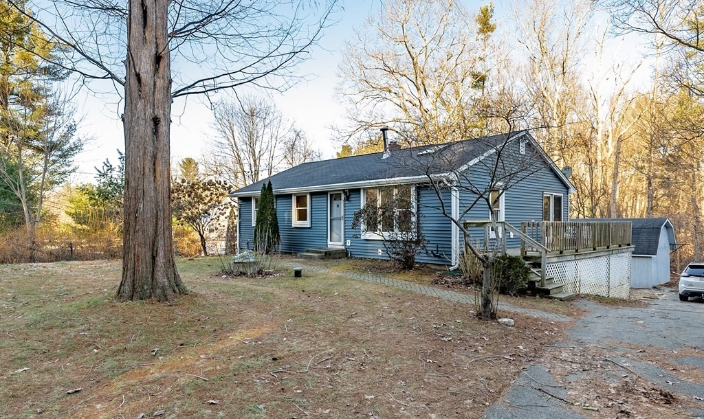 209 Freeman Road Charlton, MA 01507 - Photo 1 of 30 a view of a house with a yard covered in snow