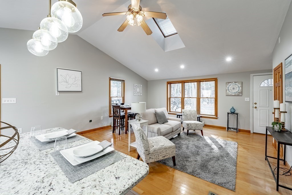 209 Freeman Road Charlton, MA 01507 - Photo 13 of 30 a living room with furniture a chandelier and a window