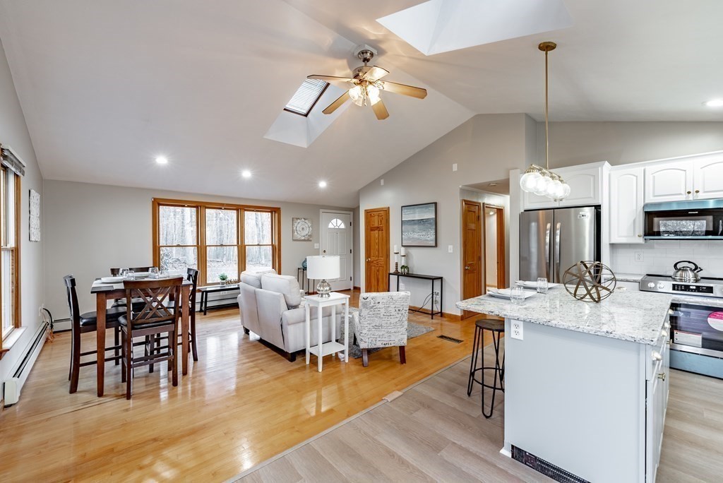 209 Freeman Road Charlton, MA 01507 - Photo 14 of 30 a view of a dining room with furniture window and wooden floor