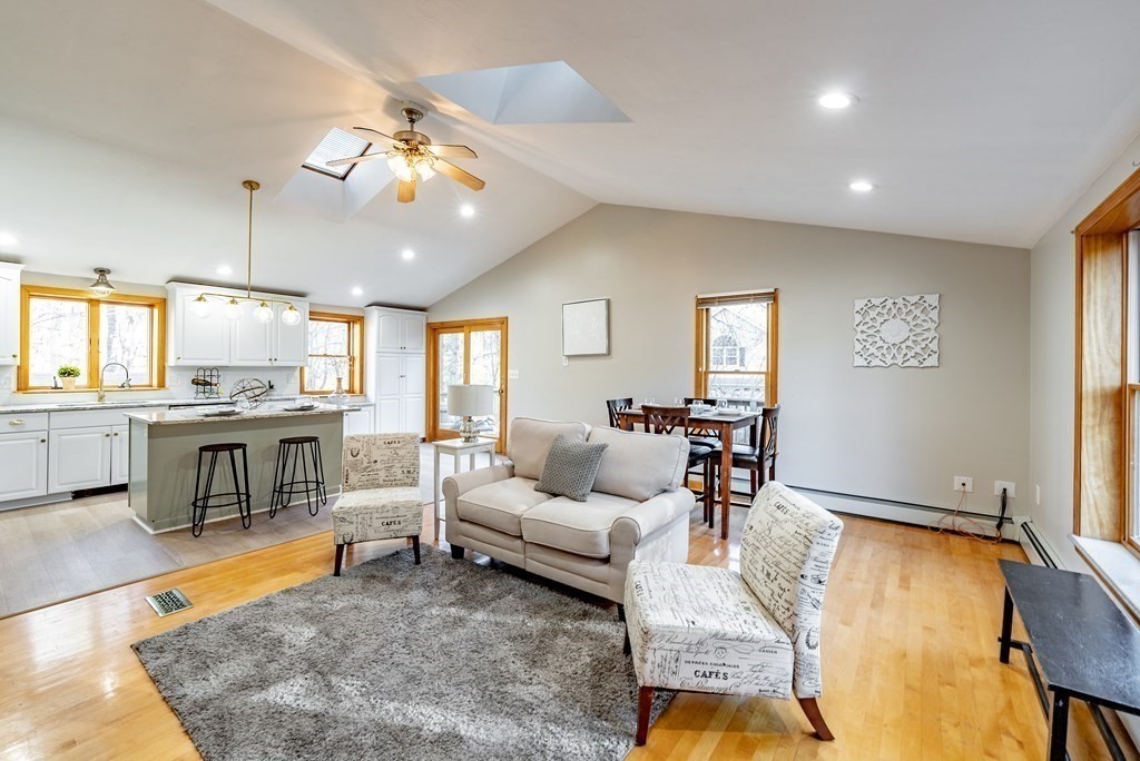 209 Freeman Road Charlton, MA 01507 - Photo 15 of 30 a living room with fireplace furniture and a table
