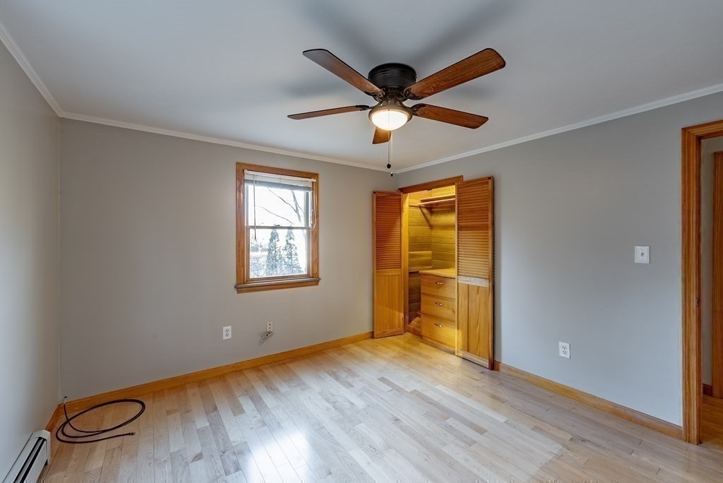 209 Freeman Road Charlton, MA 01507 - Photo 20 of 30 a view of an empty room with a window and wooden floor